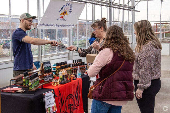 Local vendors offer samples at the Fridley Winter Farmers Market.