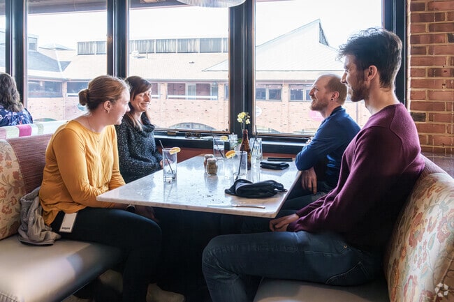 Friends gather and laugh over a good meal in Montchanin.