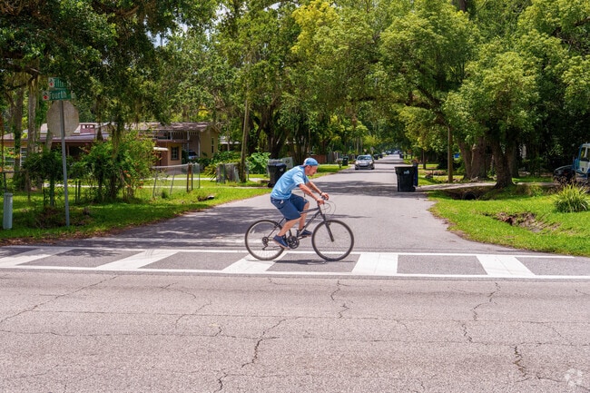 A Taft resident commutes by bike on a beautiful day in the neighborhood.
