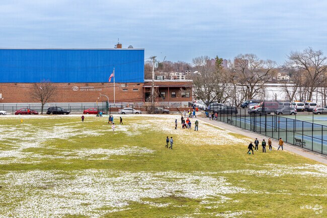 A group of children play in the field at the Arlington Boys and Girls Club near Spy Pond.