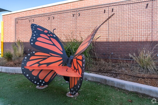 A children's park in Lumberman features a charming butterfly-shaped bench for locals to enjoy.