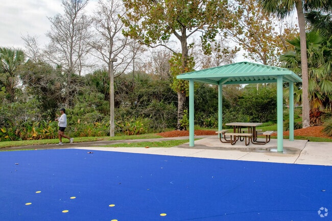 A woman walks in the park in the Coconut Creek, FL neighborhood.