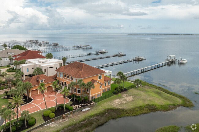 Residents of Midway SantaRosa living on the water often keep their boats at backyard docks.