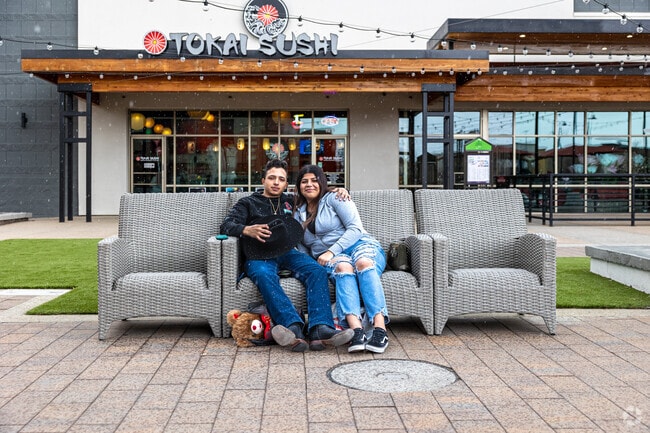 Enjoys the snowfall and some sushi at the Jordan Landing Shopping Center in West Jordan.