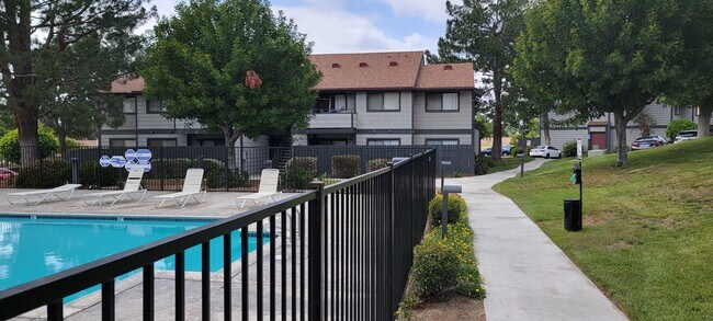 Dove Ridge scenic path by fenced pool area.