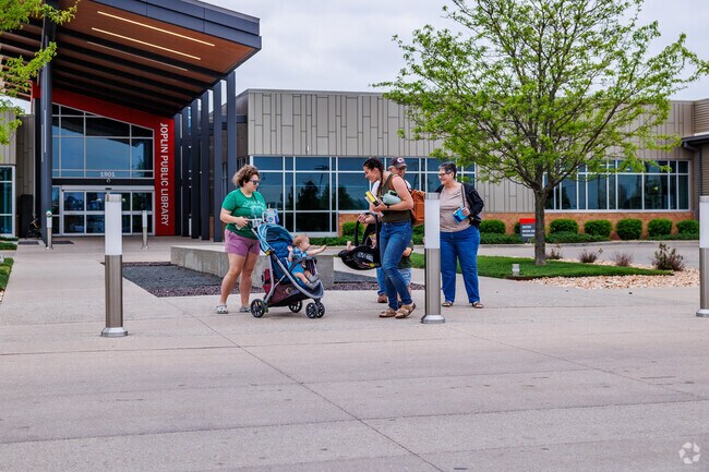 Campbell Park South residents gather at the Joplin Public Library.