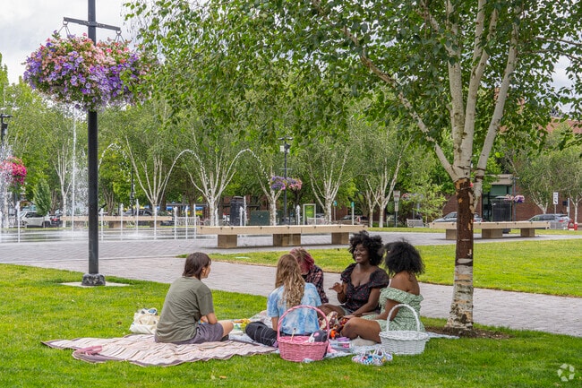 Friends enjoy a picnic at Beaverton City Park.