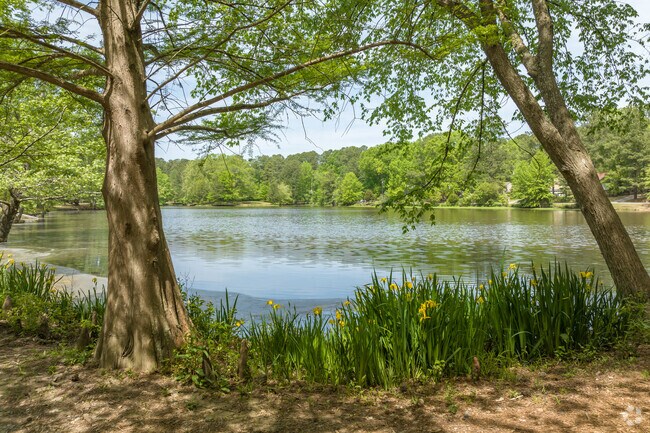 Private to the community, Clark Lake in Cross County is framed by carefully arranged trees.