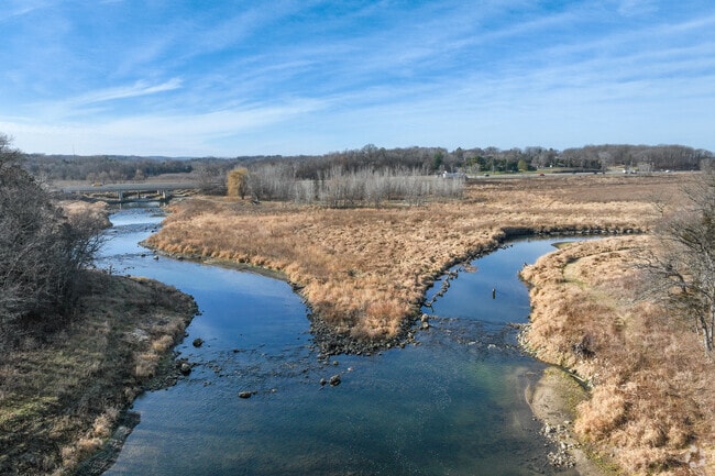 Middle Fork Zumbro River flows south of Oronoco through wooded and open areas.