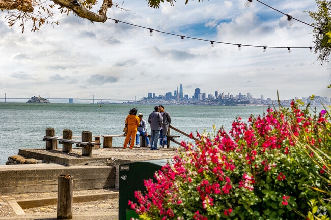 People Sit and Enjoy Yee Tock Chee Park and its Views of San Francisco