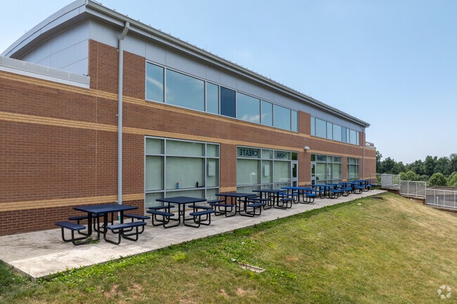 On a nice day at Marsh Creek Sixth Grade Center you can eat at a picnic table.