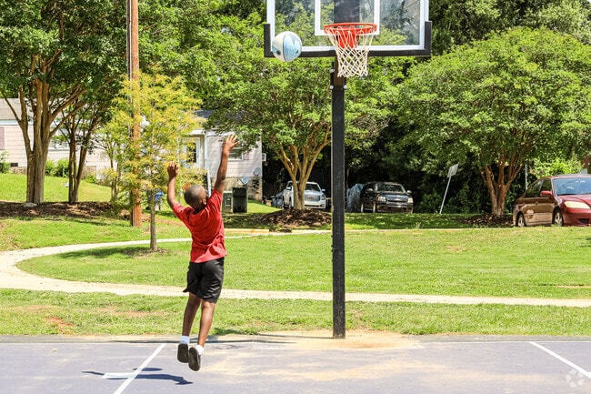 A boy shoots hoops at Hyatt Park.