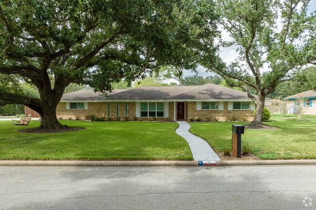 Hillcrest properties benefit from mature oak canopies.