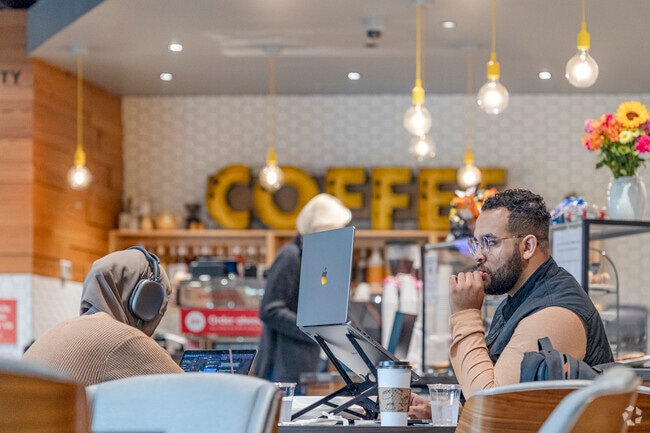 Queen Bee serves signature lattes in a cozy Yarrow Point café setting.