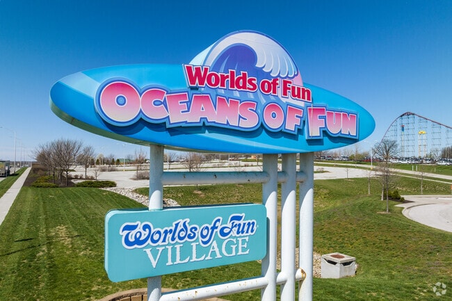 The bright and colorful entrance sign welcomes visitors to Oceans of Fun at Worlds of Fun, Kansas City’s iconic destination for water slides, rides, and summertime thrills, minutes away from Maple Park.