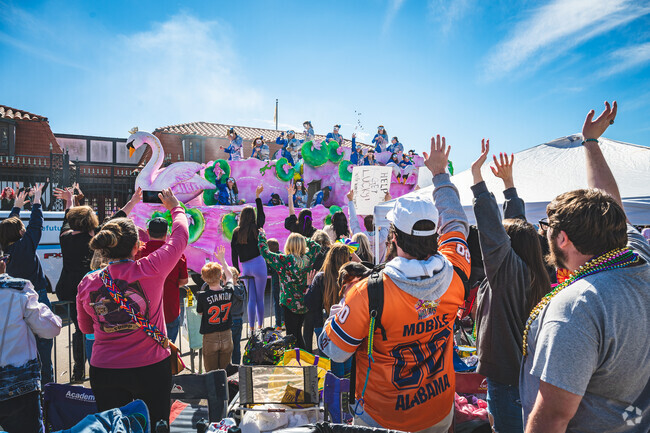 Cody residents enjoy the annual Mardi Gras Parades in Downtown Mobile.