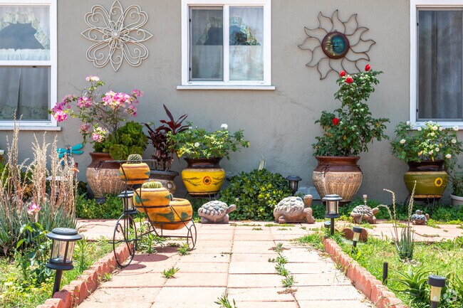 A charming bungalow in Wilson with beautiful flora and thoughtfully designed gardens.