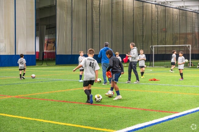 Soccer players of Whittenton Junction get on the pitch at Fore Kicks Sports Complex.
