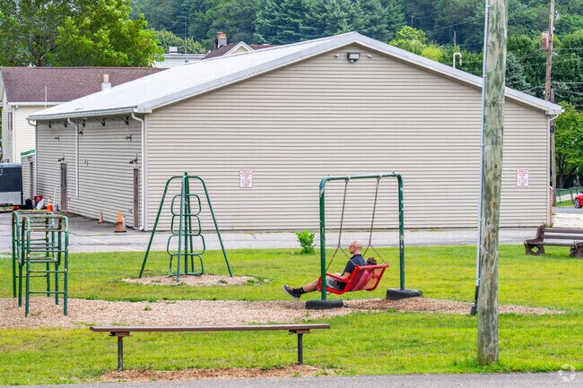 Families can enjoy each other's company while using the swing at Coaldale Complex.