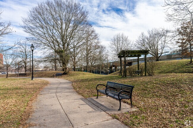 The walking path and seating at Conway Park in Ridgely's Delight invite you to bring a friend.