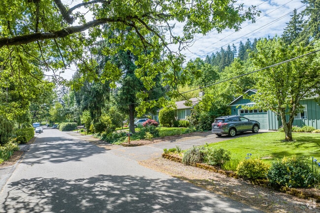 Tree-lined streets are common throughout Robinwood in West Linn.