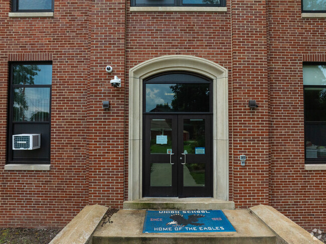 An older entrance with a brick facade is on the side of Union Elementary School.