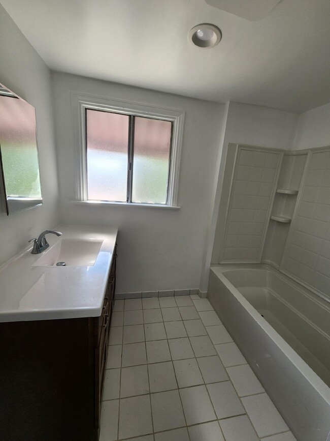 Bathroom with tub/sink combination