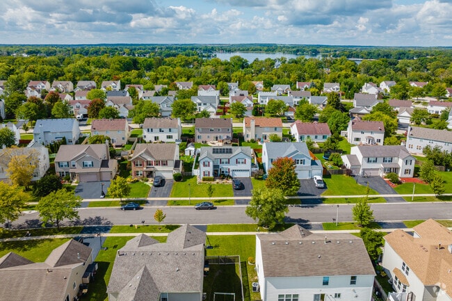 Homes in Tiffany Farms sit neatly between thriving trees and well-maintained roads.