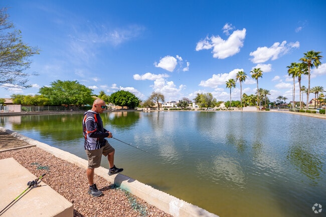 Immerse yourself in nature's beauty while fishing in the serene lakes of Garden Lakes.