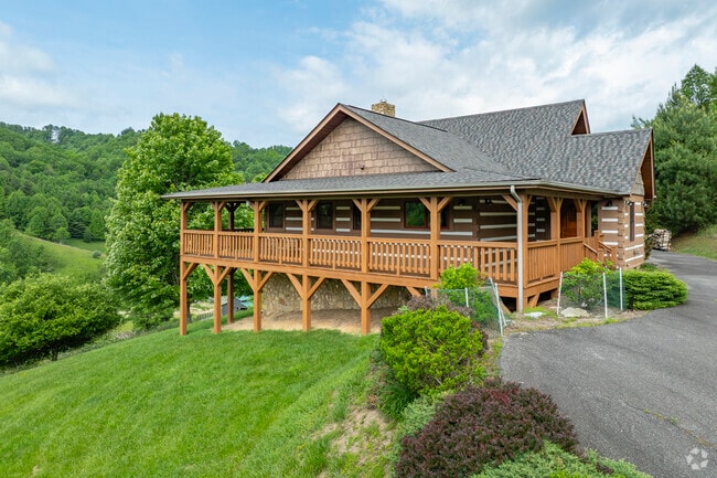 Newland custom homes blend rustic timber designs with modern open layouts to highlight scenic mountain views.