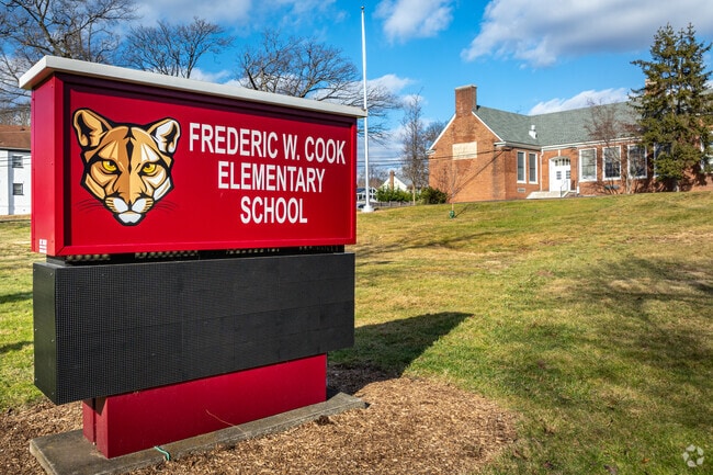 The mascot adorned roadside signage for Frederic W. Cook School in Plainfield, NJ.