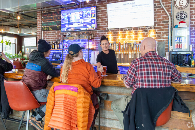 Conestoga Community residents raise a glass to good times at The Session Room.
