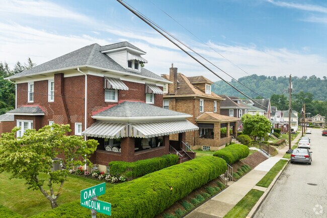 These single, brick homes line a street in Springdale.