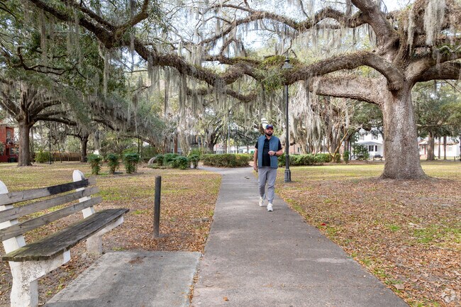 Myers Park has trees draped with Spanish moss are has benches with a bit of green space.