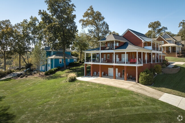 Large multi-story homes maximize their riverside views in Lakesite.