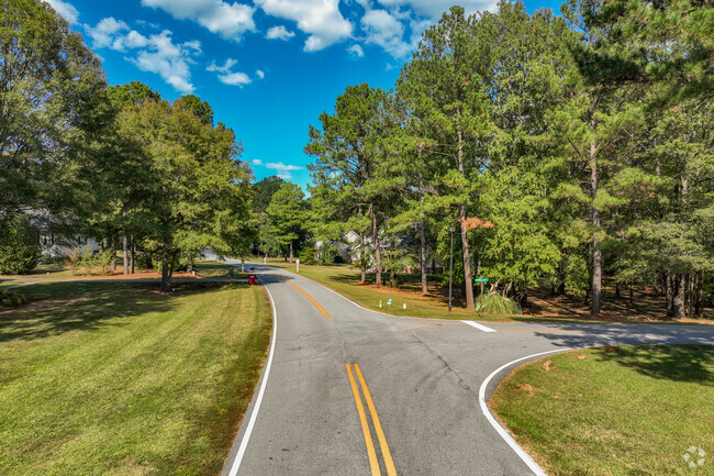 Manicured streets are seen at The Pines at Gray.
