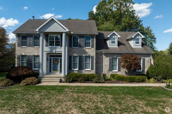 Located in Howland Center, this modern Colonial-style home is situated on a quiet street.