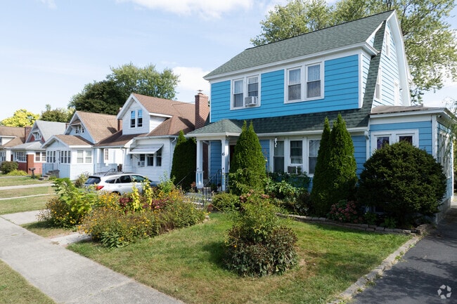 A lovely Dutch Colonial sits along side several Craftsman styled homes in Whitehall.