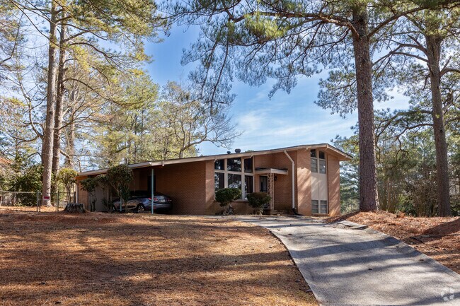 This lovely home showcases charming mid-century style and is nestled within the welcoming Arlington Estates community.