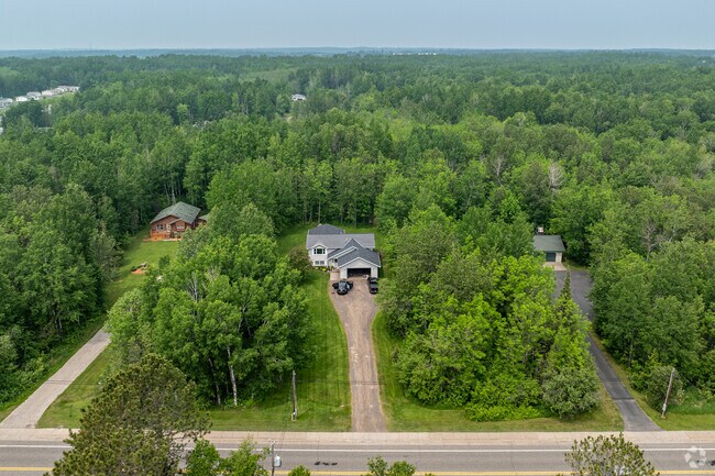 Many roads in Hermantown have a rural feel, with homes nestled within private, tree-lined lots.
