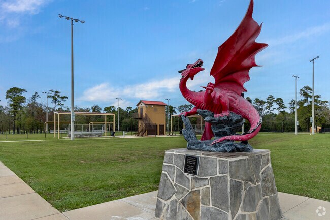 A local mascot, the red dragon, adds charm to Riley Chambers Park, in the heart of Barrett.