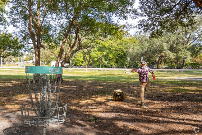 This frisbee golfer wraps up a nice day on the mostly shaded course in Coachman.