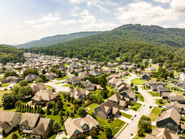 Aerial view of homes in the mountains in the background in the Falling Waters neighborhood.
