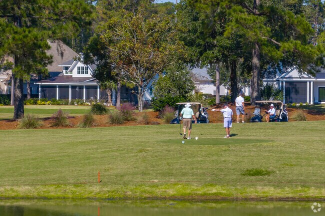 Members enjoy a friendly round of golf on the lush and beautiful Berkley Hall courses.