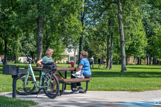 Friends and residents of Erb Park in Appleton like to gather in the shade.