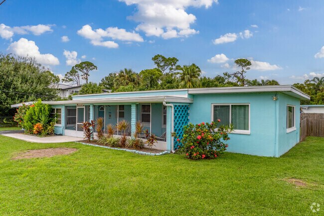 Charlotte Harbor homes deliver tropical vibes with brightly colored stucco.