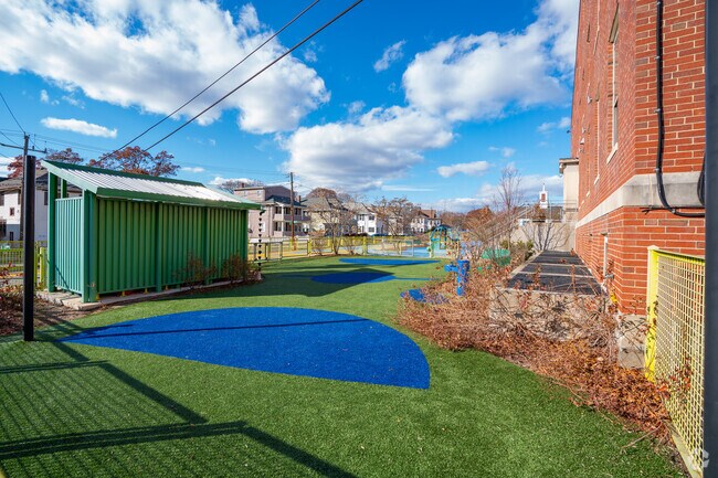 There's a small turf area next to the elementary building at the International School of Boston.