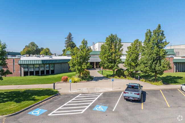 Greenacres Middle School features a small staff parking lot beside the school.