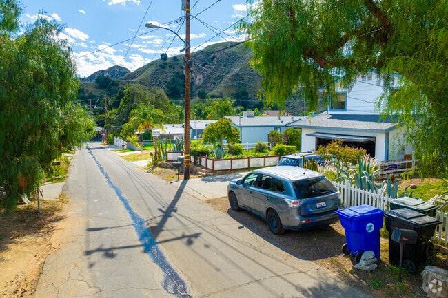 Mature trees shade residential streets in Val Verde.