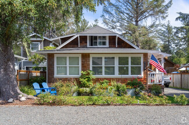 Cedar plank shingles adorn this two story cottage in Cannon Beach.
